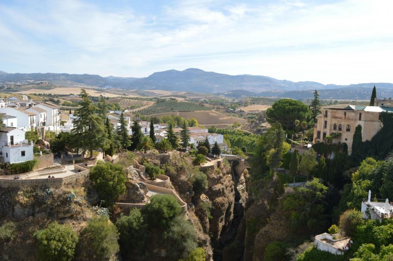 Explore the stunning cliffside view of Ronda, Spain, showcasing its unique architectural charm and scenic landscapes.